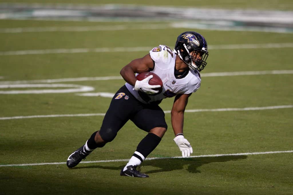 Baltimore Ravens running back Gus Edwards runs with the ball during News  Photo - Getty Images