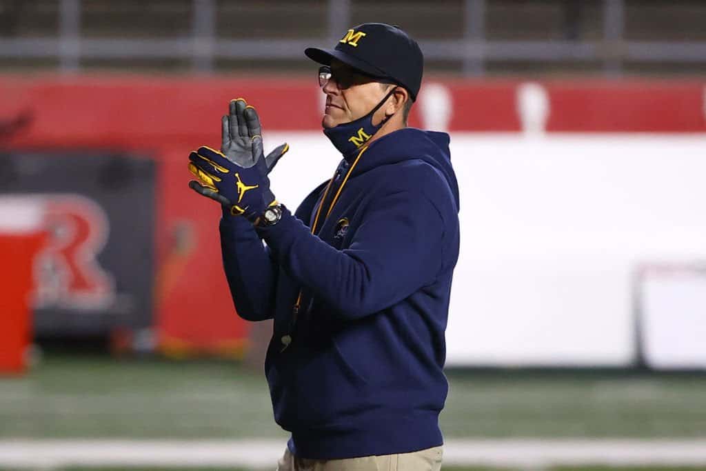 As NFL buzz begins, Jim Harbaugh says he'll be back at Michigan in