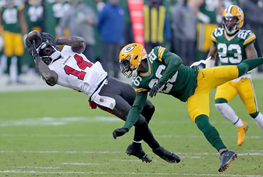 Tampa Bay Buccaneers wide receiver Chris Godwin (14) catches a pass over  Atlanta Falcons corner …