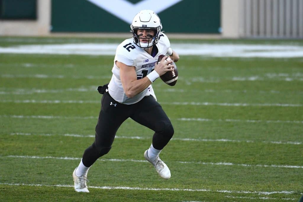 Peyton Ramsey of the Northwestern Wildcats signals a receiver against