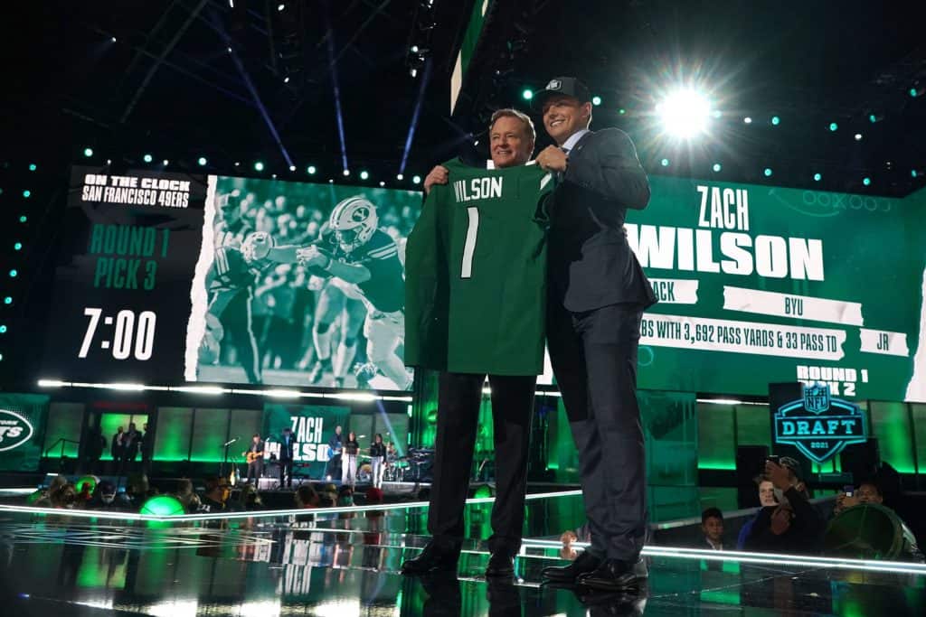 BYU quarterback Zach Wilson holds a New York Jets jersey on stage after  being selected second overall in the first round of the NFL football draft,  Thursday, April 29, 2021, in Cleveland. (