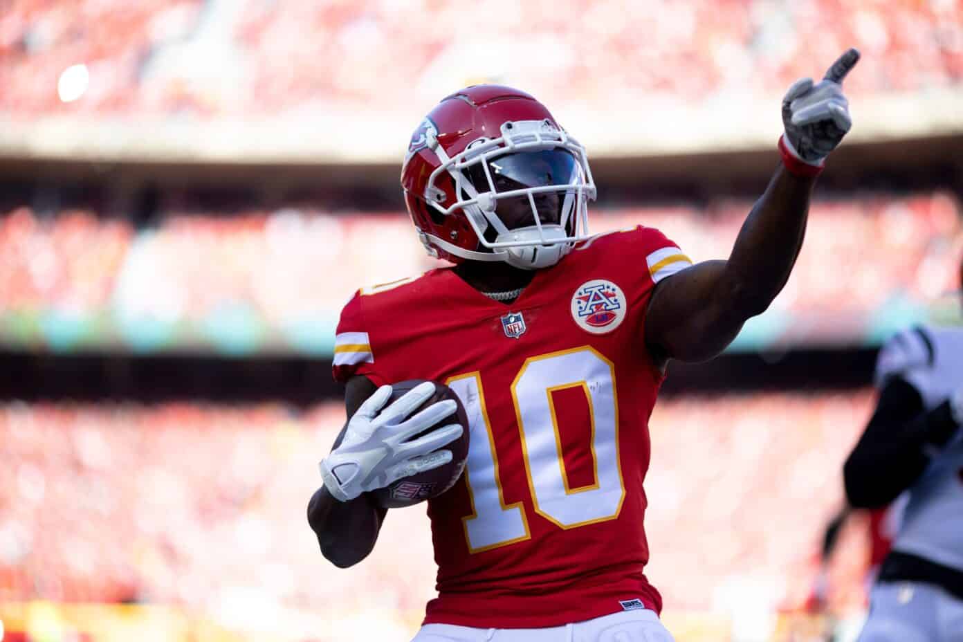 Tyreek Hill's contract details, salary cap impact, and bonuses