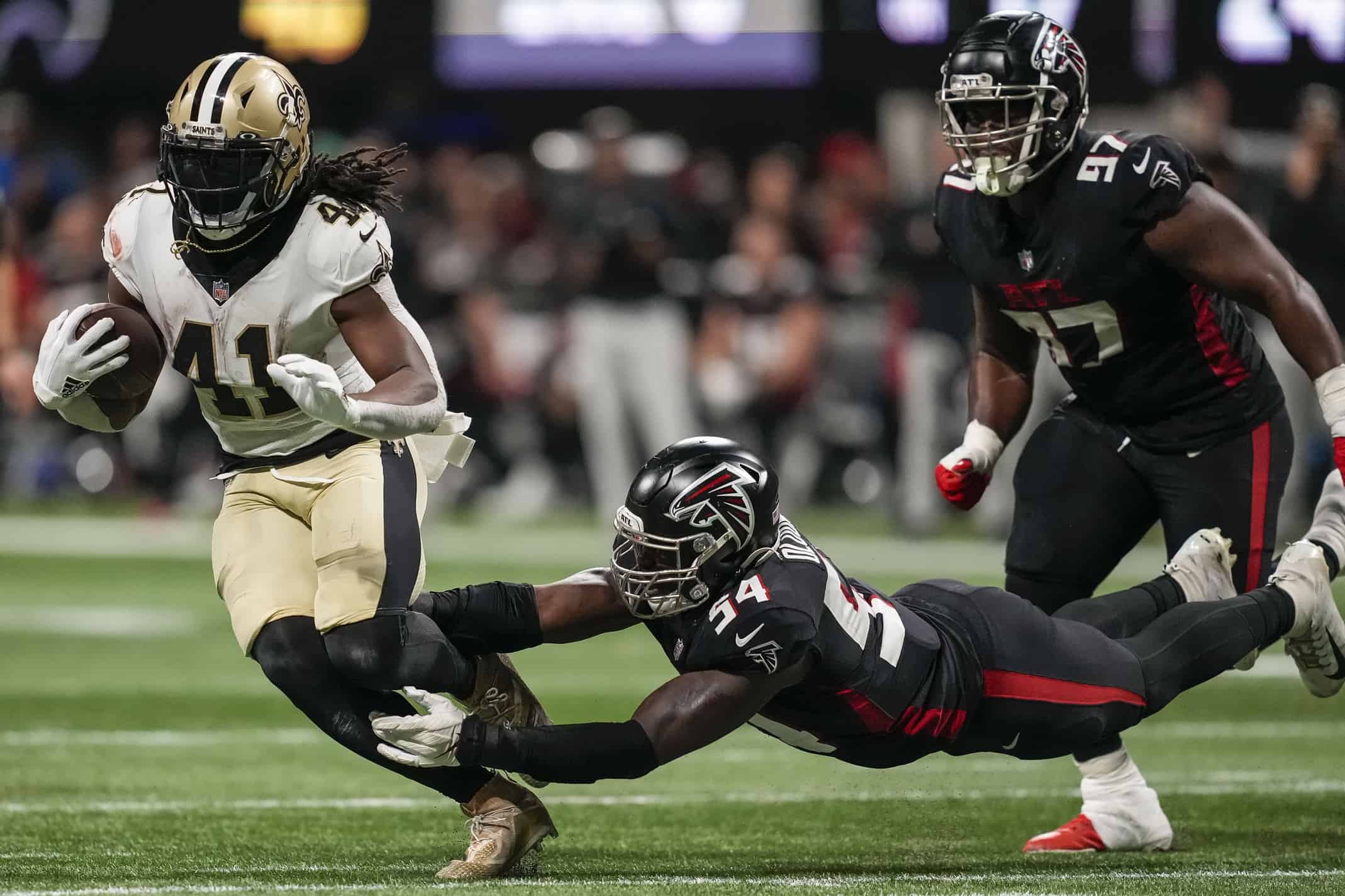 Atlanta Falcons linebacker Foye Oluokun (54) reaches ts after a Atlanta  Falcons recovery on a kickoff against the New Orleans Saints during the  second half of an NFL football game, Thursday, Nov.