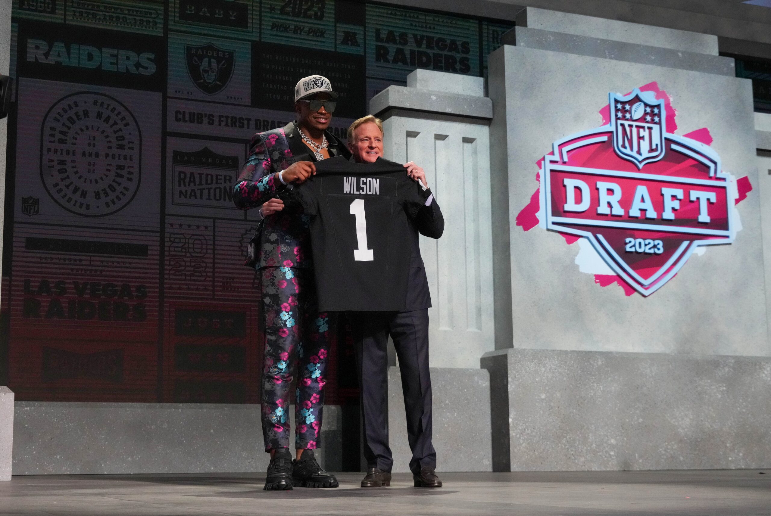 Defensive end Tyree Wilson poses for pictures with NFL Commissioner Roger Goodell at the 2023 NFL Draft after Wilson's selection to the Las Vegas Raiders.