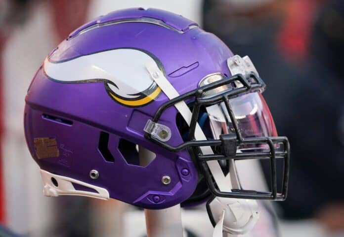 The helmet of the Minnesota Vikings hanging on the team's bench.