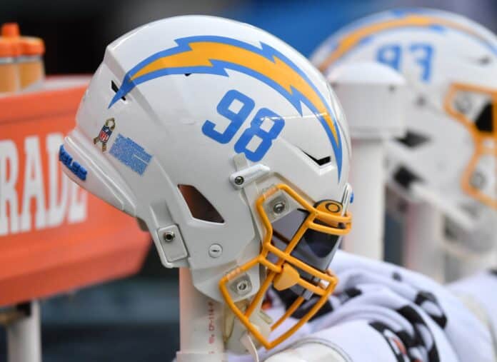The Los Angeles Chargers helmet hanging from the bench on the team's sidelines.