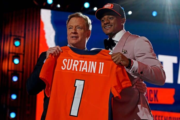CB Pat Surtain II poses with NFL Commissioner Roger Goodell for pictures after being selected by the Denver Broncos.