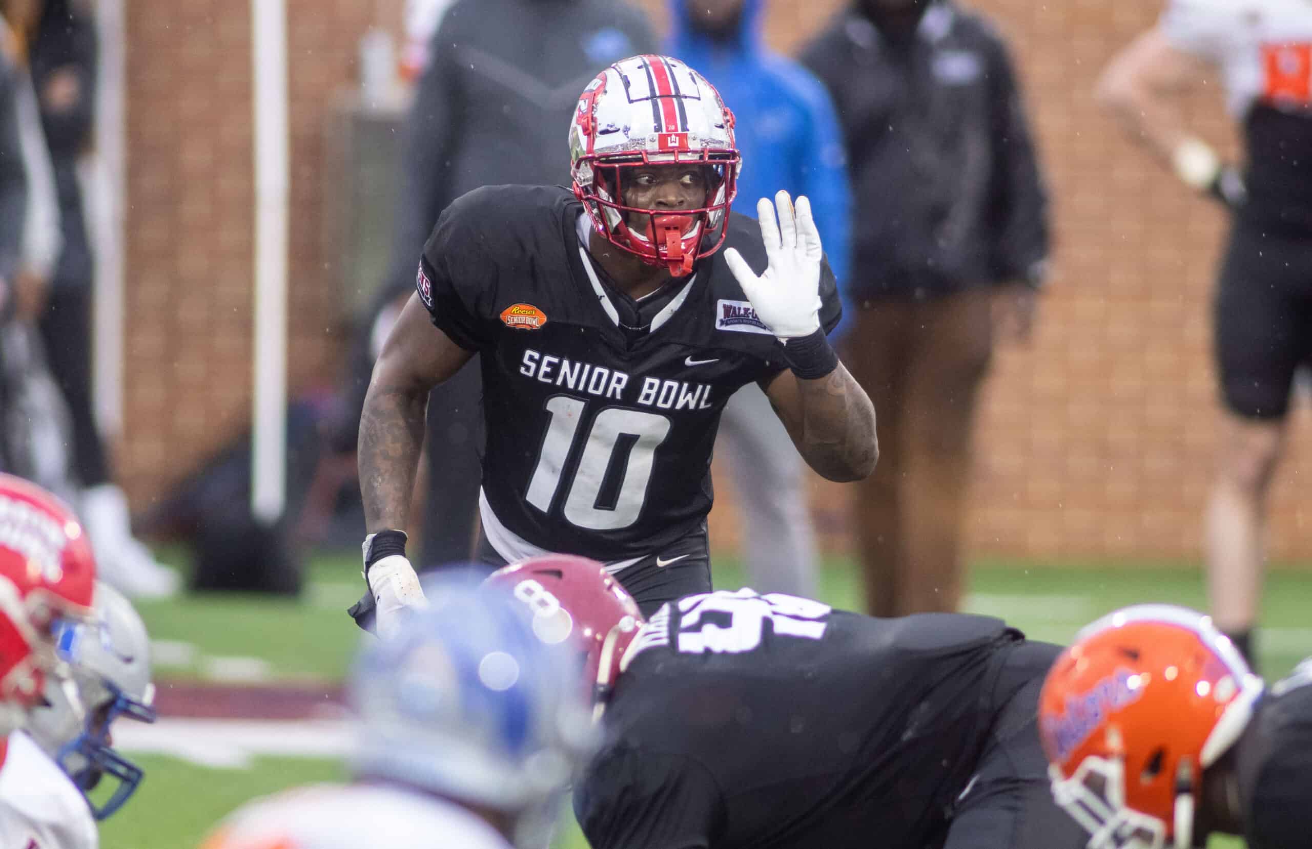 American Team defensive lineman DeAngelo Malone of Western Kentucky (10)  runs through drills during practice for