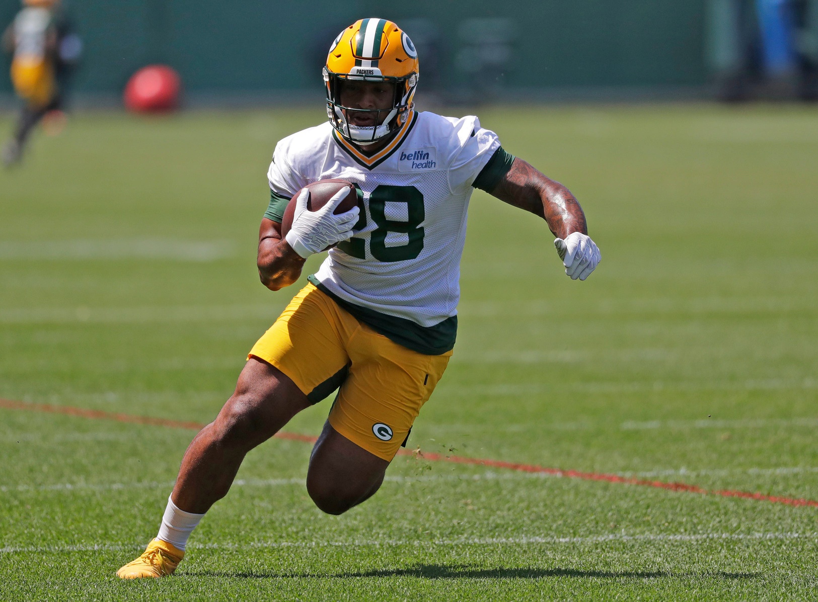 Packers rookie RB Dillon already in town and hard at work