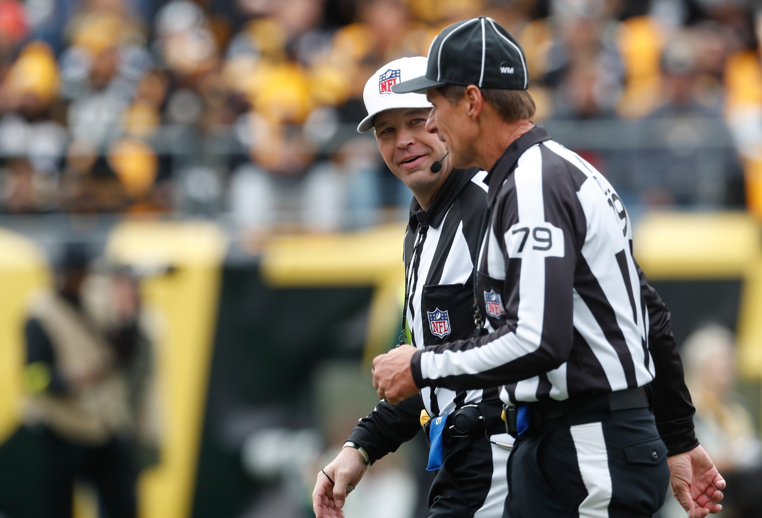 Referee Ronald Torbert, left, watches a replay of the Las Vegas