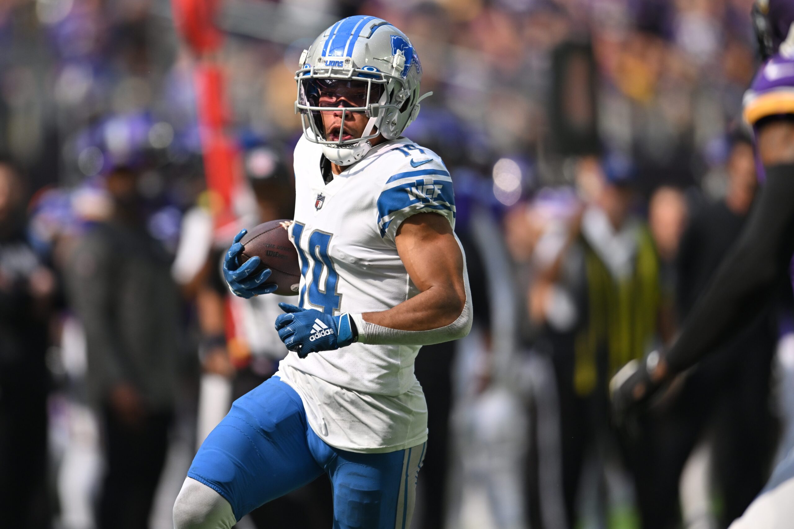 Detroit Lions' Jameson Williams (9) and Amon-Ra St. Brown before