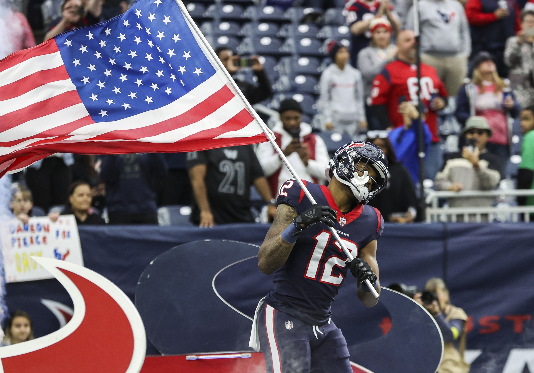 HOUSTON, TX - NOVEMBER 20: Houston Texans wide receiver Nico Collins (12)  holds on to the ball