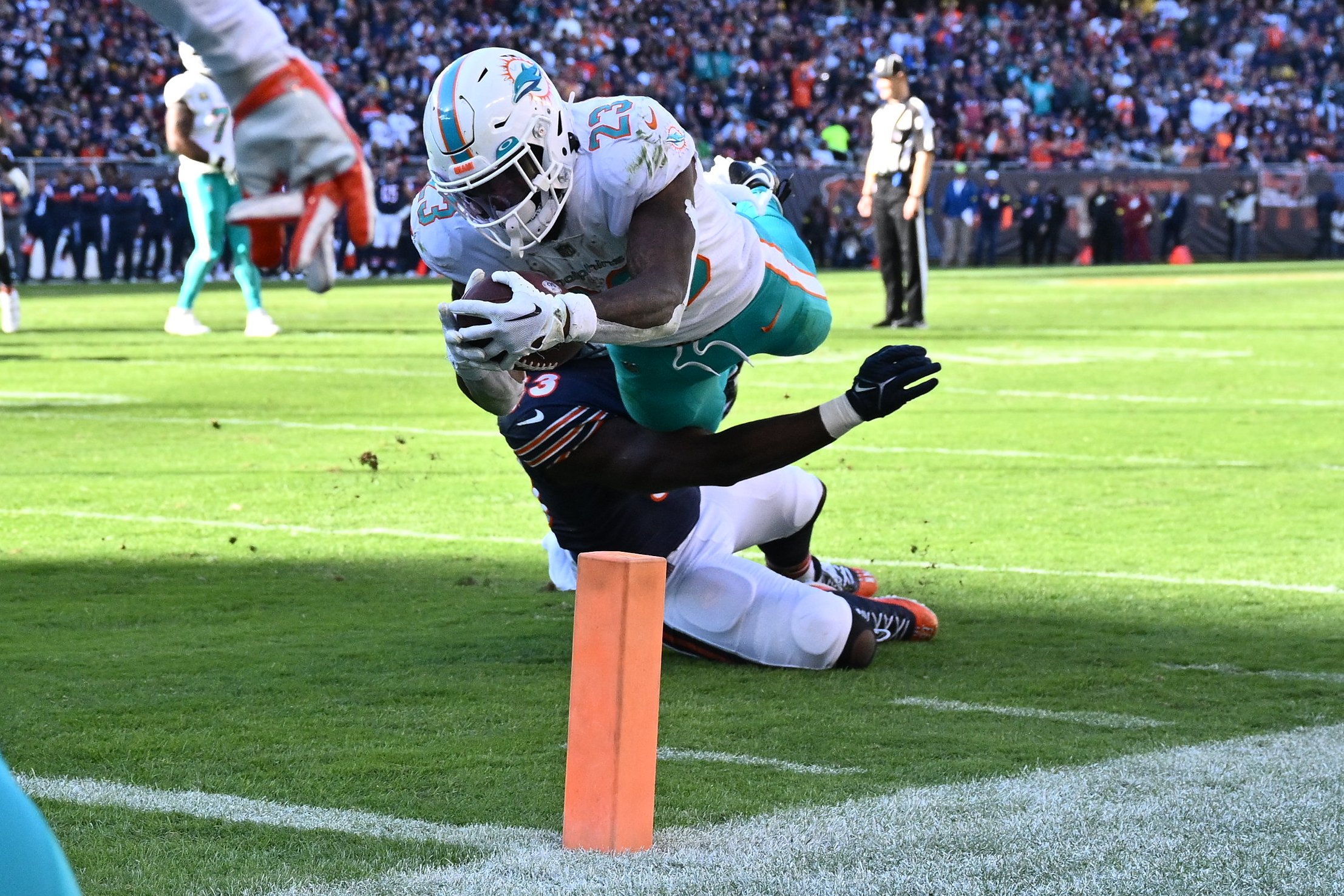 Miami Dolphins running back Jeff Wilson Jr. (23) runs on the field