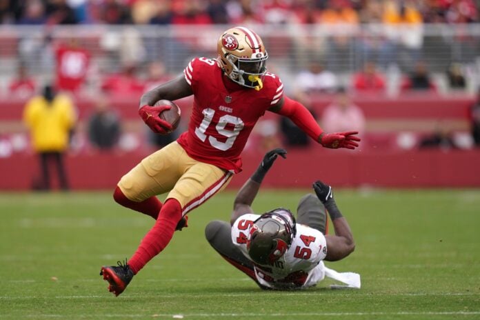 Deebo Samuel injury: 49ers WR suffers an ankle injury in Week 14, carted  off the field - DraftKings Network