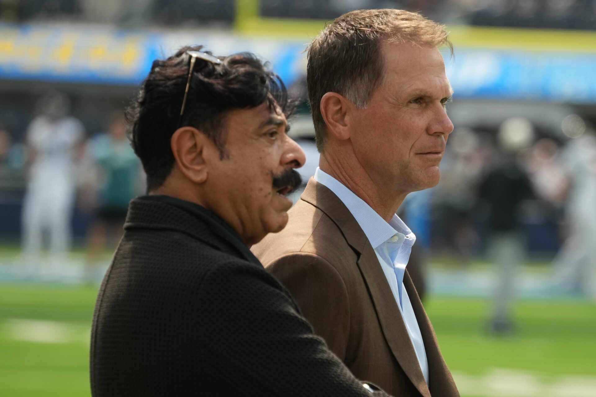 Jacksonville Jaguars owner Shad Khan and general manager Trent Baalke on the sidelines during a game.