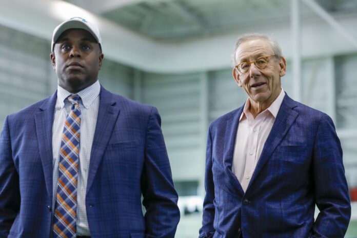 Miami Dolphins GM Chris Grier and owner Stephen Ross attend a press conference.