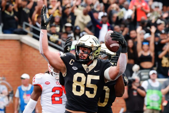Wake Forest TE Blake Whiteheart celebrates after scoring a touchdown against Clemson.