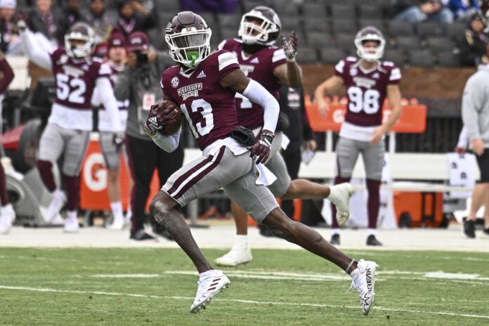 Mississippi State cornerback Emmanuel Forbes (13) intercepts the ball for a touchdown.