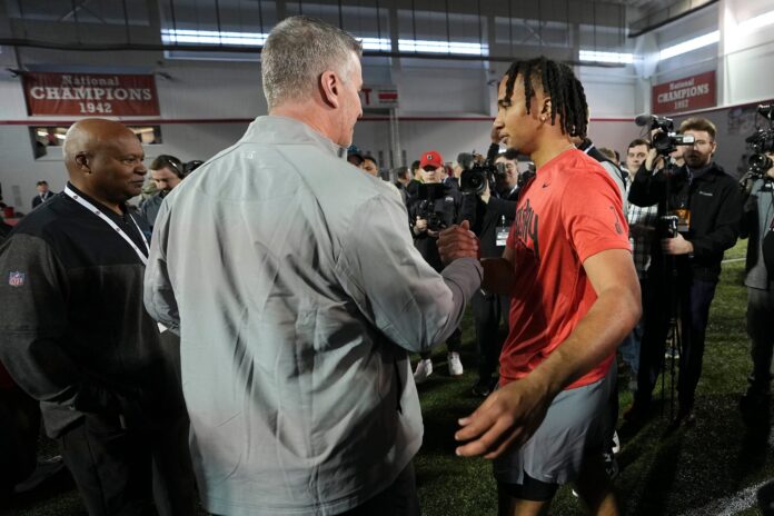 Ohio State QB C.J. Stroud talks with Carolina Panthers head coach Frank Reich during the Buckeyes' Pro Day.