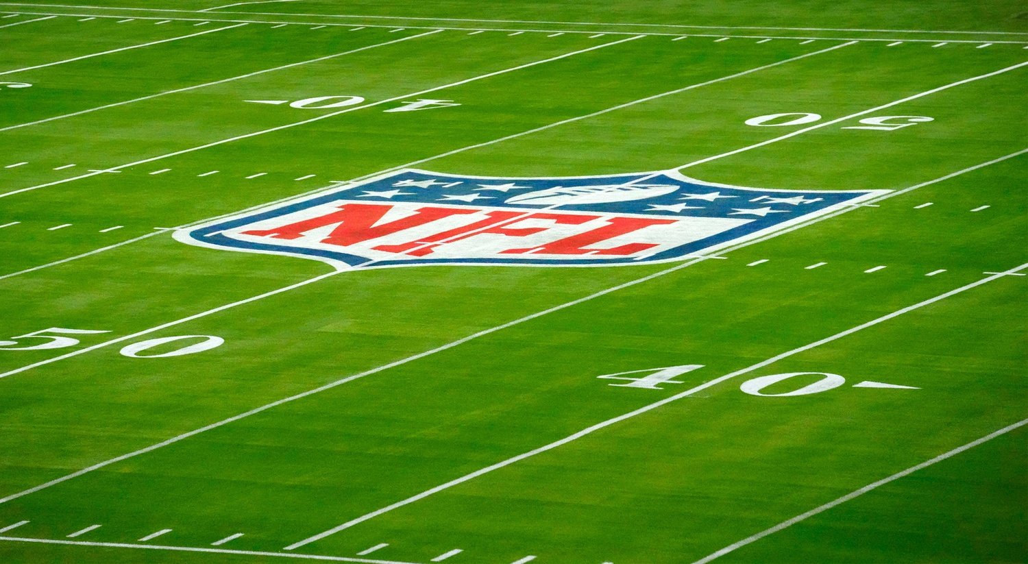 The NFL logo is seen on the field for Super Bowl LVII at State Farm Stadium.