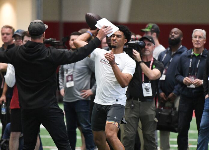 Bryce Young throws during Pro Day at Hank Crisp Indoor Practice Facility on the campus of the University of Alabama.