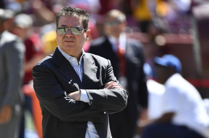 Daniel Snyder looks over the field before a game against the Dallas Cowboys.