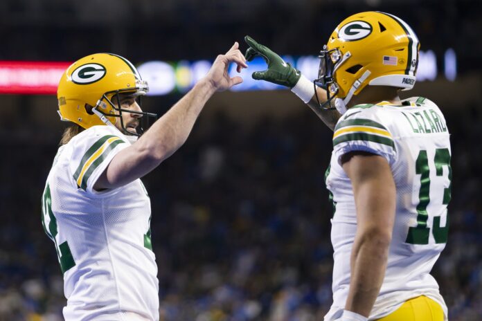 Green Bay Packers QB Aaron Rodgers (12) and WR Allen Lazard (13) celebrate.