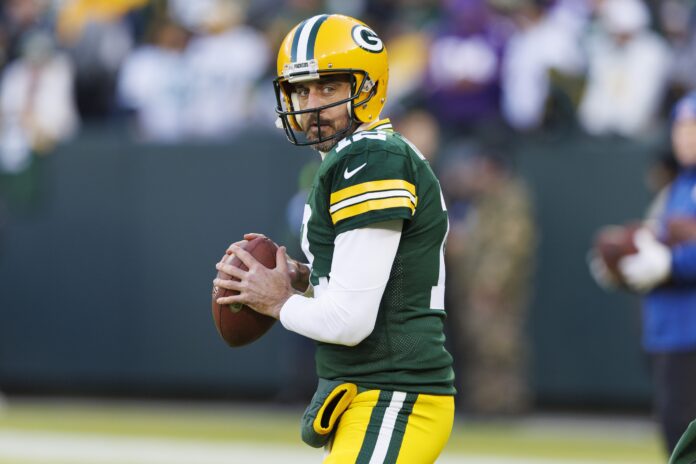 Green Bay Packers QB Aaron Rodgers (12) drops back to pass.