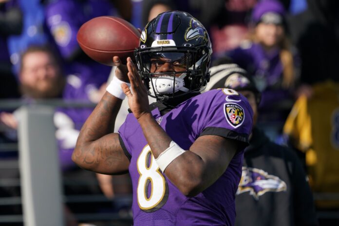 Lamar Jackson warms up prior to the game against the Denver Broncos.
