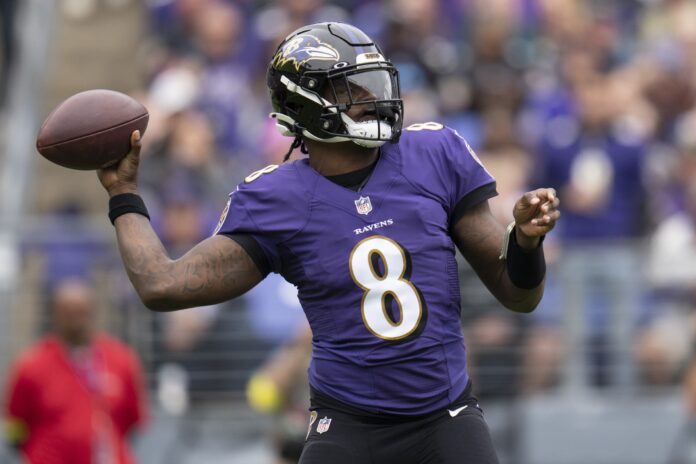 Baltimore Ravens quarterback Lamar Jackson (8) throws the ball against the Cleveland Browns during the first half at M&T Bank Stadium.