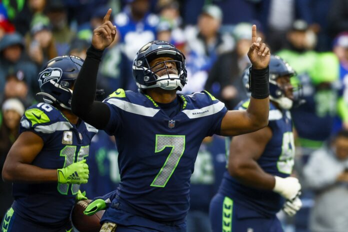 Geno Smith celebrates after throwing a touchdown pass against the New York Giants.