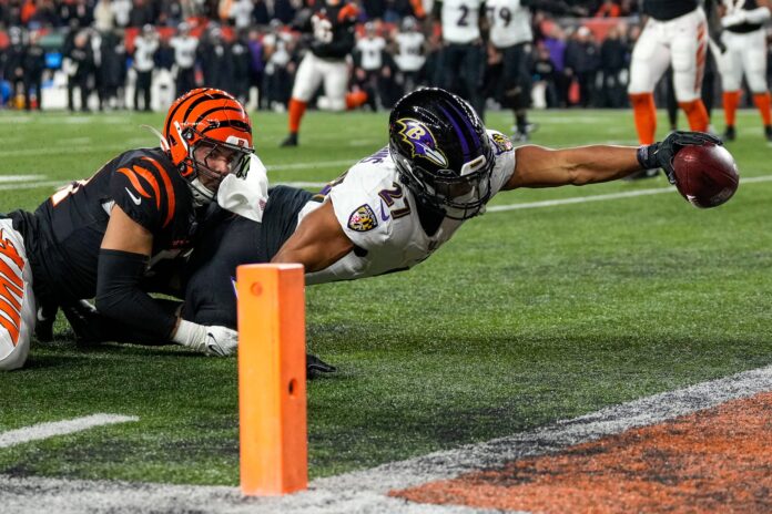 J.K. Dobbins reaches for the end zone against the Bengals.