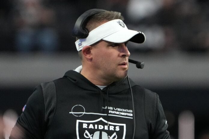 Josh McDaniels watches from the sidelines against the Kansas City Chiefs.