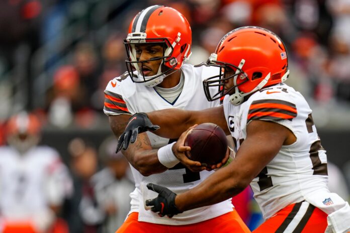 Browns quarterback Deshaun Watson hands off to running back Nick Chubb.