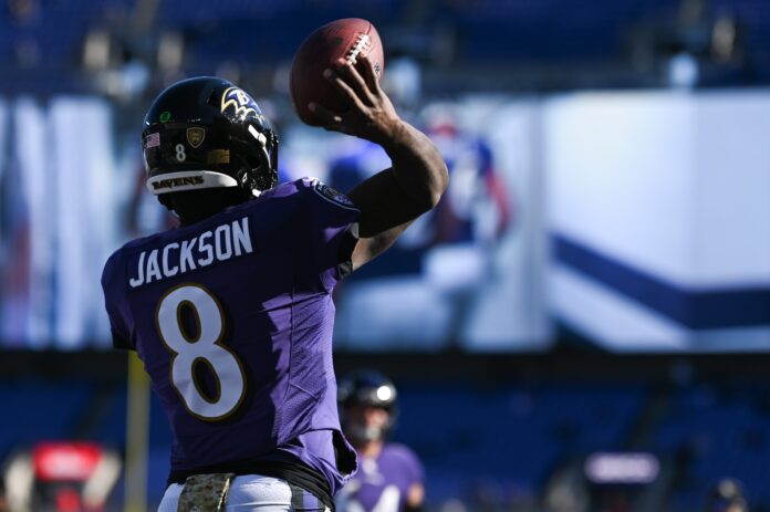 Lamar Jackson warms up before the game against the Carolina Panthers.