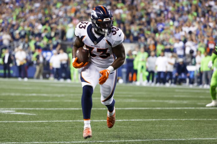 Javonte Williams runs for yards after the catch against the Seattle Seahawks.