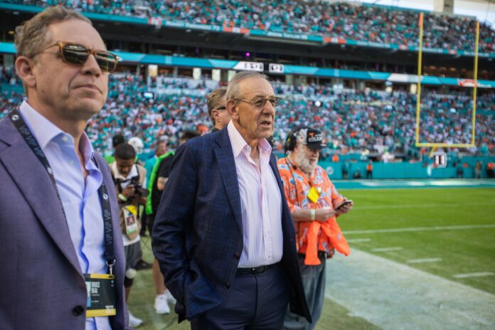 Miami Dolphins owner Stephen Ross watches the game against the Jets from the sidelines.