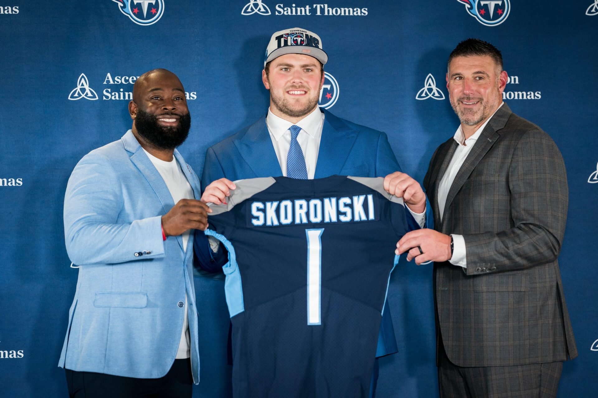 Tennessee Titans first-round draft pick offensive tackle Peter Skoronski, center, poses with general manager Ran Carthon, left, and head coach Mike Vrabel, right, during a press conference at Ascension Saint Thomas Sports Park in Nashville, TN.