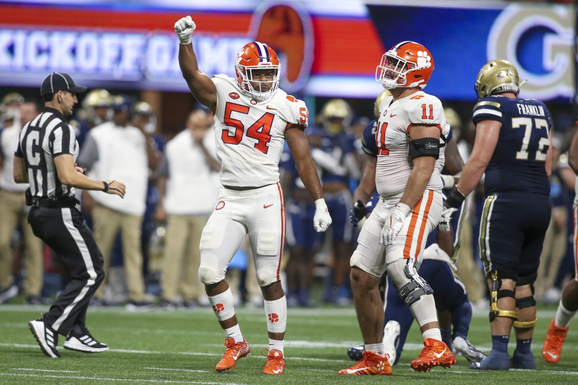 Clemson Tigers linebacker Jeremiah Trotter Jr. (54) and defensive tackle Bryan Bresee (11) celebrate after a stop against the Georgia Tech.