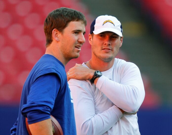 Eli Manning (left) and San Diego Chargers quarterback Philip Rivers talk prior to game at Giants Stadium.