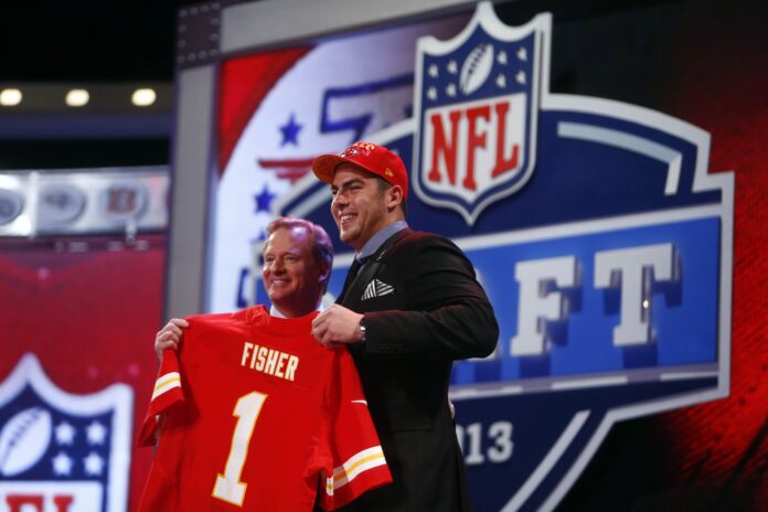 Roger Goodell (left) introduces Eric Fisher (Central Michigan) as the number one overall pick to the Kansas City Chiefs.