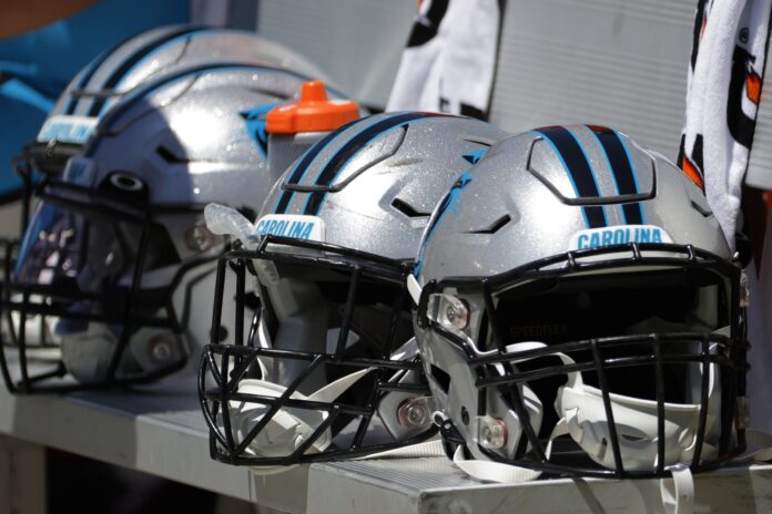 Carolina Panthers players helmets rest on the bench against the Washington Commanders.