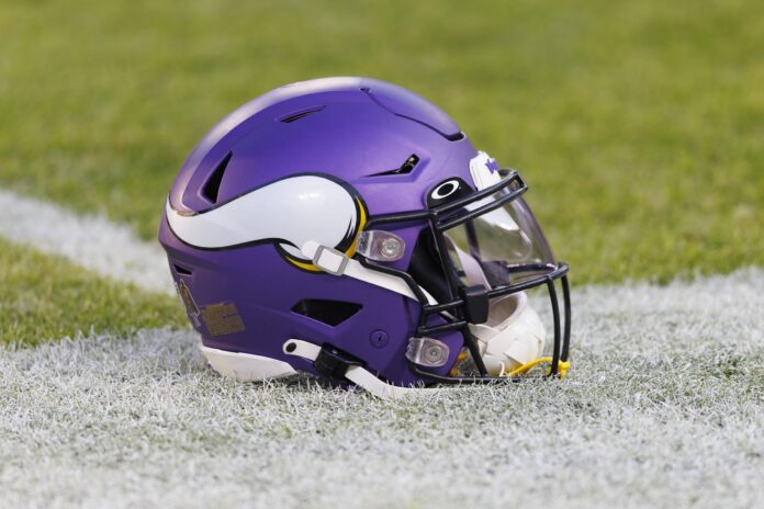 A Minnesota Vikings helmet sits on the field during warmups prior to the game against the Green Bay Packers at Lambeau Field.