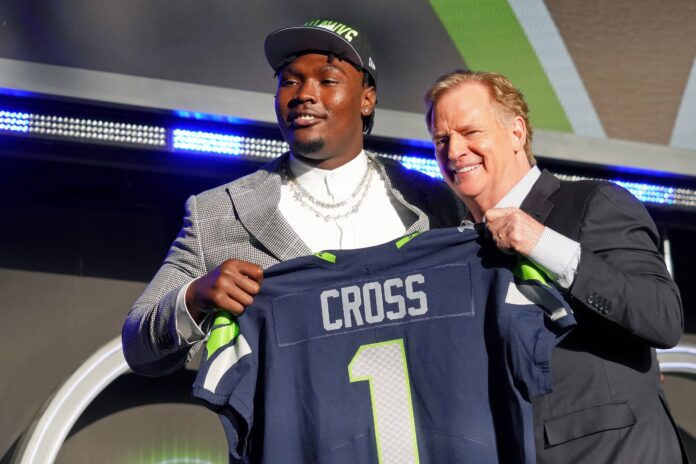 Charles Cross with NFL commissioner Roger Goodell after being selected as the ninth overall pick to the Seattle Seahawks.