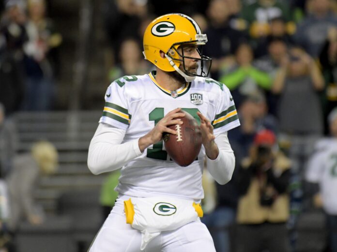 Aaron Rodgers (12) throws a pass against the Seattle Seahawks during the first half at CenturyLink Field.