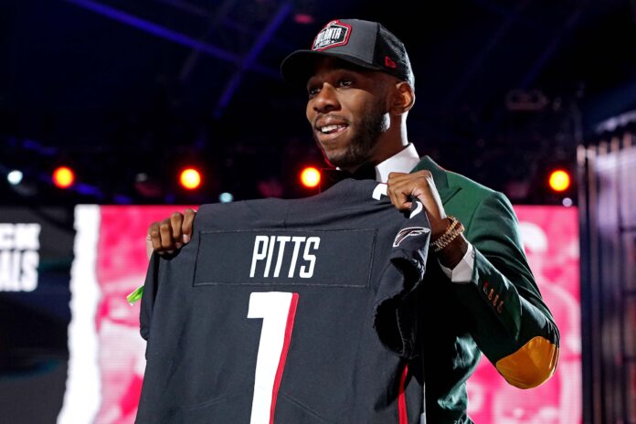 Kyle Pitts (Florida) poses with a jersey after being selected by the Atlanta Falcons.