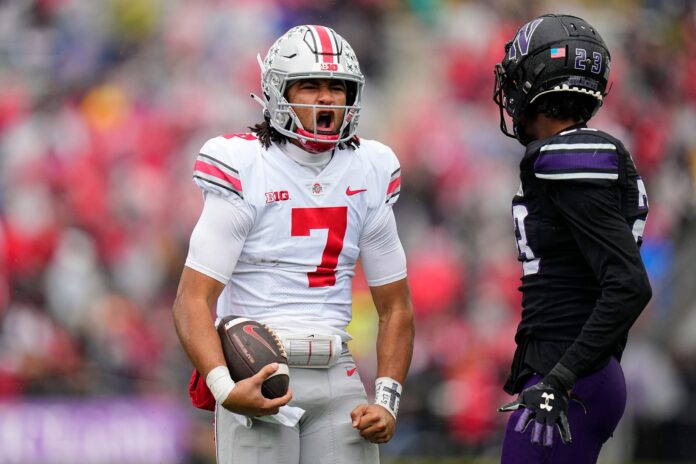 Ohio State QB C.J. Stroud celebrates after a first down against Northwestern.