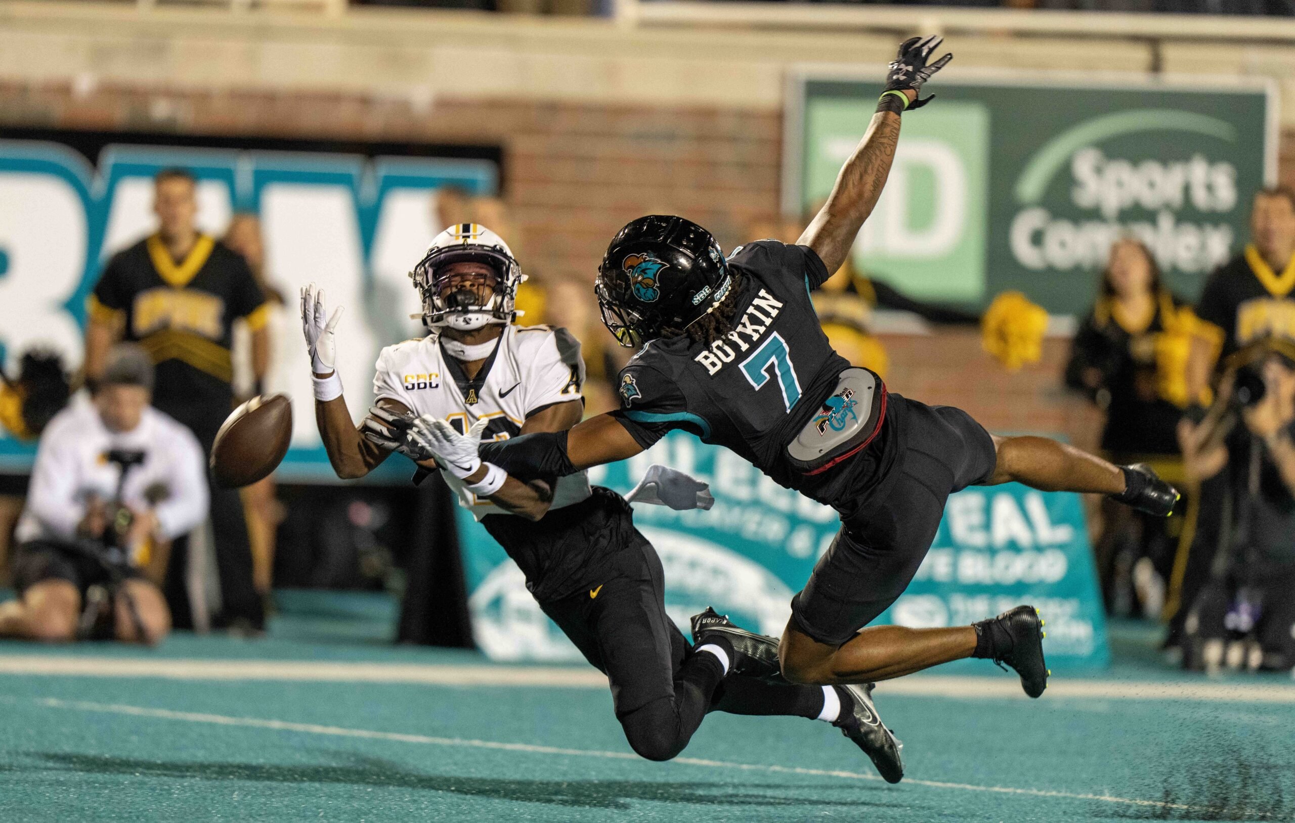 Coastal Carolina Chanticleers cornerback Lance Boykin (7) disrupts a pass.