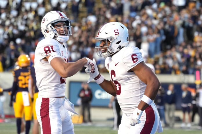 Elijah Higgins (6) celebrates with wide receiver Brycen Tremayne (81) after scoring a touchdown against the California Golden Bears.