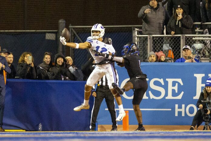 Brigham Young Cougars wide receiver Puka Nacua (12) makes a touchdown catch against the Boise State Broncos in the second half at Albertsons Stadium.
